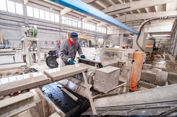 Adult Man Working on Production Line Of a Stone Processing Factory.